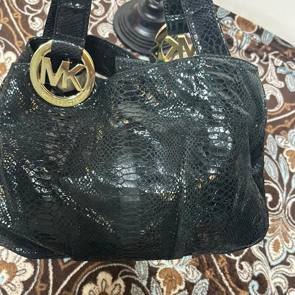 Michael Kors Black Hobo Bag with Gold Emblem